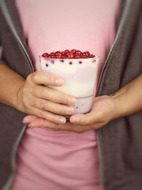 Midsection of woman holding ice cream