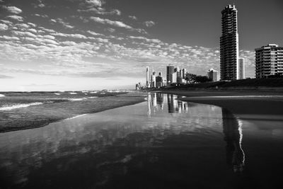 Scenic view of sea and buildings against sky