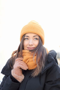 Portrait of smiling young woman in snow