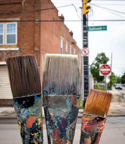 Close-up of paintbrushes in container