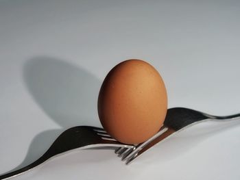 Close-up of breakfast on table against white background