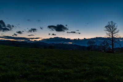 Scenic view of field against sky during sunset