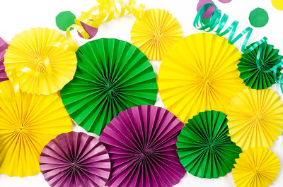 Low angle view of colorful decorations against white background