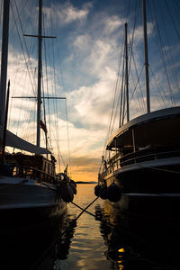 Boats sailing in sea against sky