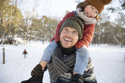 Portrait of smiling woman in snow