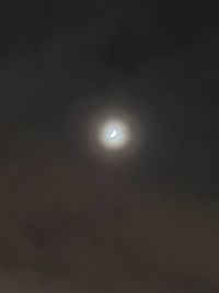 Low angle view of moon in sky at night