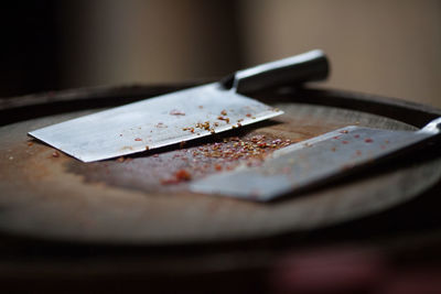 Close-up of butcher knife on table