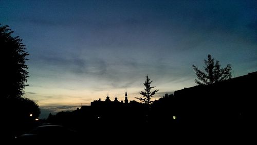 Silhouette of built structure against sky at dusk