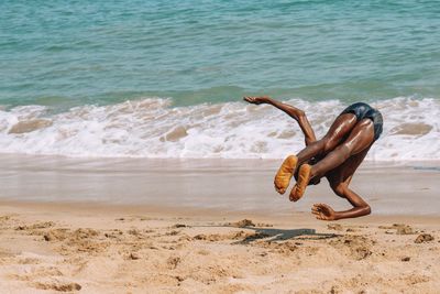 High angle view of shirtless man on beach