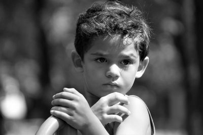 Close-up of cute boy looking away