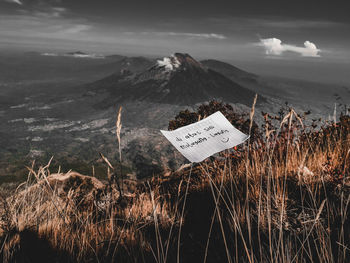 Panoramic shot of text on land against sky