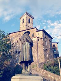 Low angle view of statue against cloudy sky