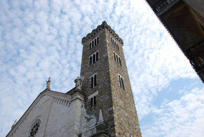 Low angle view of bell tower against sky