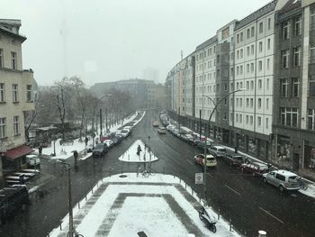 High angle view of snow covered cityscape