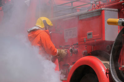 Side view of man working in factory