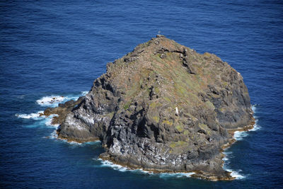 High angle view of rock formation in sea