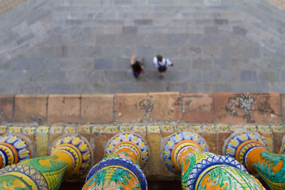 Overhead view of a couple of people, walking in plaza de espana, sevilla 