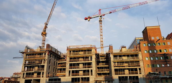 Low angle view of buildings against sky in city