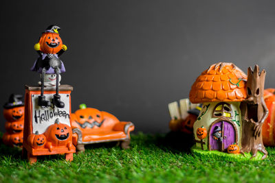 Close-up of stuffed toy on grass during halloween
