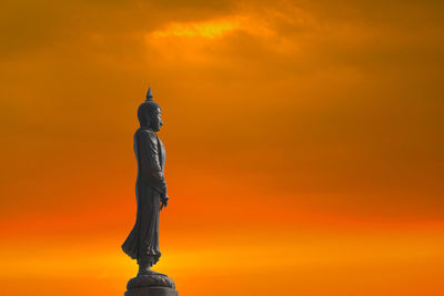 Low angle view of statue against sky during sunset