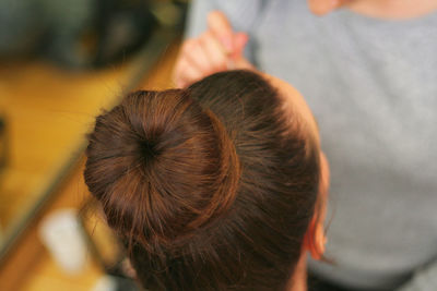 Rear view of woman with hair bun