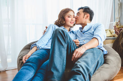 Young couple sitting on sofa