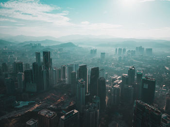 Aerial view of cityscape against sky