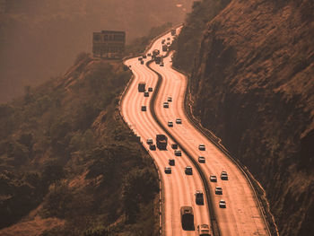 High angle view of road amidst trees in city