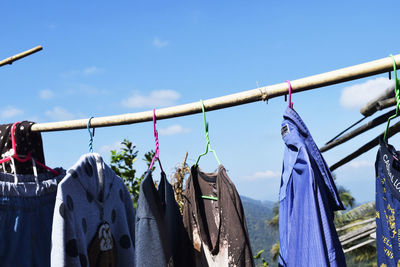 Clothes drying on clothesline against sky