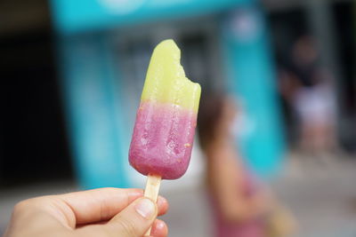 Close-up of hand holding ice cream