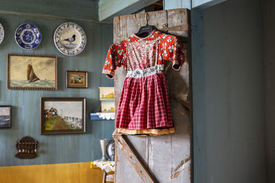 Rear view of woman standing against wall