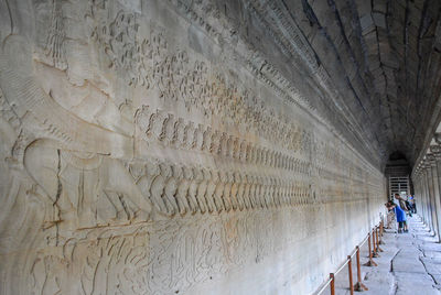 Panoramic view of people on wall of building