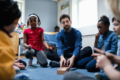 Group of people sitting at home