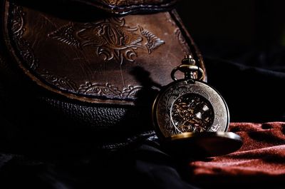Close-up of clock against black background