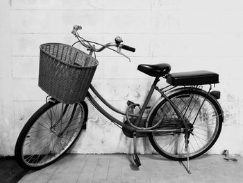 Bicycle leaning on wall
