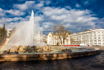 View of the beautiful buildings at vienna city center and the fountain at schwarzenbergplatz