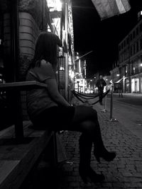 Woman standing at night