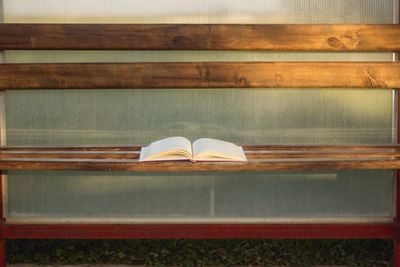 High angle view of open book on bench