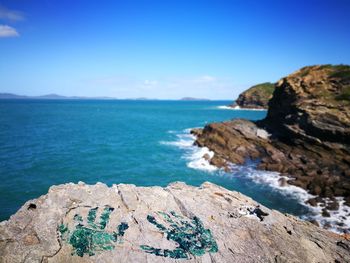 Scenic view of sea against blue sky