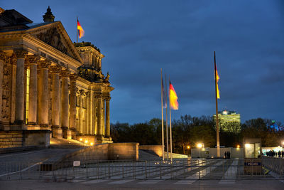 Government building against sky at night