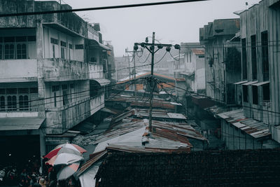 Buildings in city against sky