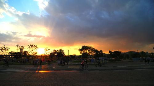 View of road against cloudy sky at sunset