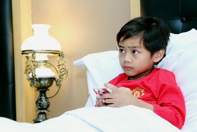 Boy on bed at home