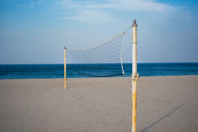 Volley ball net stands on a off-season sand beach of east sea, south korea