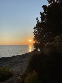 Scenic view of sea against sky during sunset