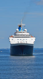 Ship sailing on sea against sky