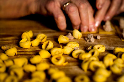 Close-up of person preparing food on table