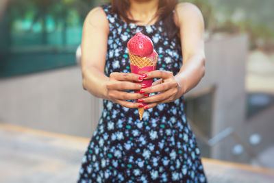Close-up of woman holding balloon