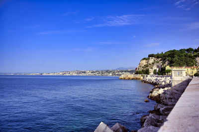 Scenic view of sea against blue sky