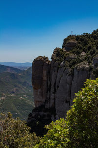 Rock formations on mountain against sky